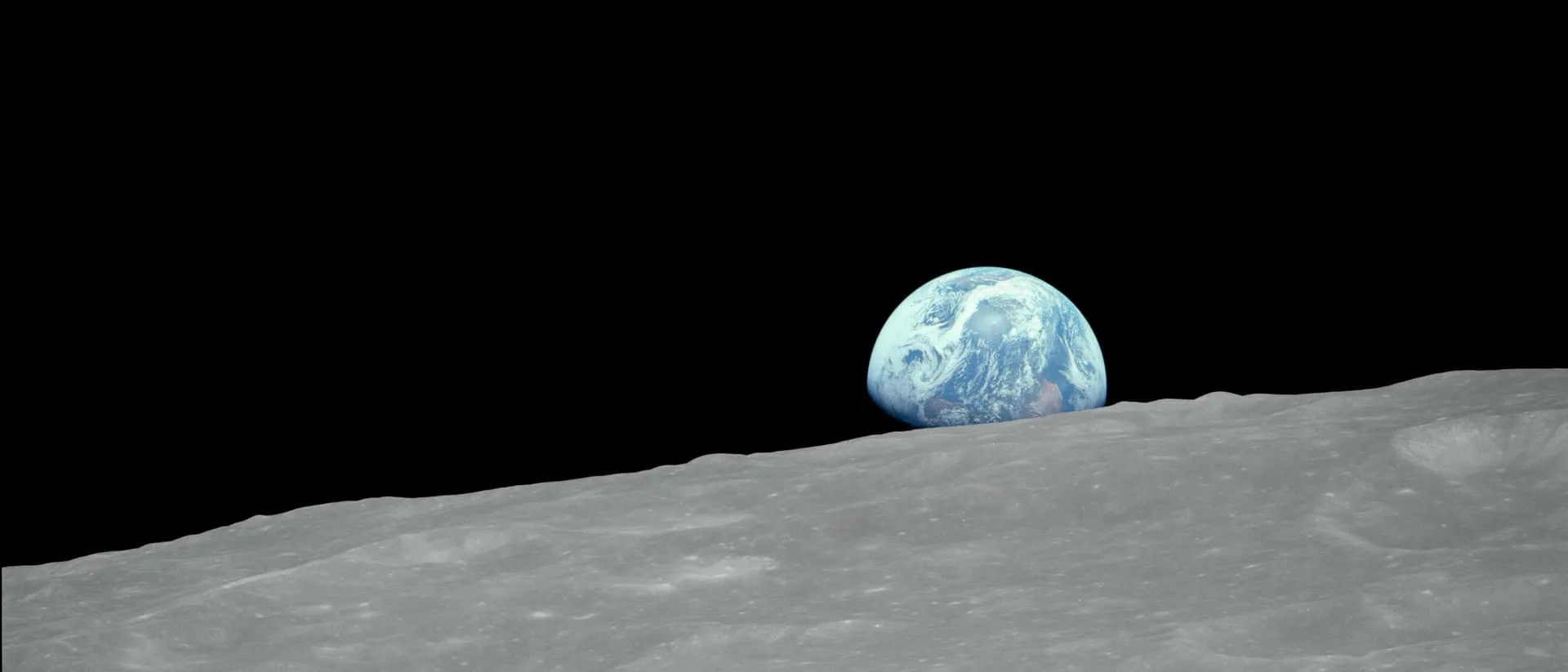 Earthrise: the Earth rising over the Moon's horizon, photographed from Apollo 8